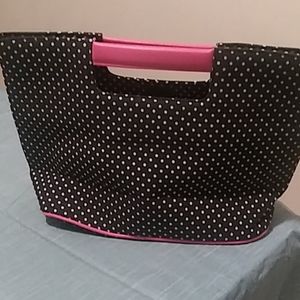 Small tote type handbag with flower pin